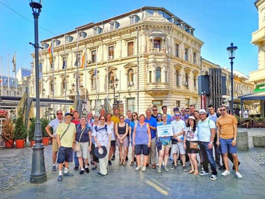 Tour group in front of building