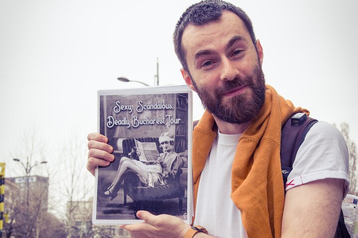 Guide holding tour sign